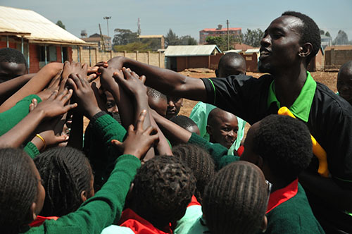 children with cricket coach in kenya